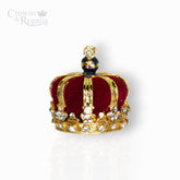 Gold crown with a cross on top, featuring colored gemstones, on a white background with 'Crowns & Regalia' branding.